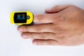 A persons hand palm using a pulse oximetry, noninvasive method for monitoring people`s oxygen saturation