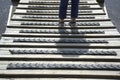 Persons legs staying on bridge with rubbery non slippery protection.