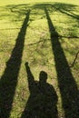 Persons shadow in a green field Royalty Free Stock Photo