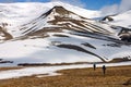 Persons Walking Tundra in Svalbard Royalty Free Stock Photo