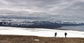 Persons Walking Tundra in Svalbard Royalty Free Stock Photo