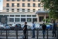 4 persons, young and old, men and women, waiting their bus and tram at a transportation stop on a boulevard of Belgrade Royalty Free Stock Photo