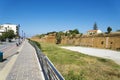 Perspective of brick wall along the road. Royalty Free Stock Photo