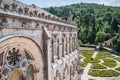 Luso, PORTUGAL - June 14, 2022 - Perspective of BuÃ§aco palace in neo-Manueline style, garden and forest in the background