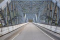 Perspective center angle view at the bridge in metallic truss structure over Douro River in Pinhao city, asphalt road Royalty Free Stock Photo