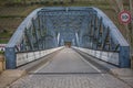 Perspective center angle view at the bridge in metallic truss structure over Douro River in Pinhao city, asphalt road Royalty Free Stock Photo