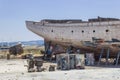 Perspective close shot of back side fishing boat on ground for painting of trunk at Lesvos, Kalloni Royalty Free Stock Photo