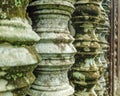 Perspective; close up of an old ancient columns with lichen and moss, Angkor Wat, Cambodia Royalty Free Stock Photo