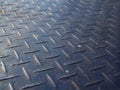 Perspective close up old rusty dirty blue iron steel checker plate Royalty Free Stock Photo