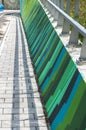 Perspective of a colourful concrete walkway bridge Royalty Free Stock Photo