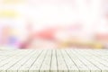 Perspective empty white wooden table over blurred shopping mall Royalty Free Stock Photo