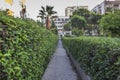 Perspective front shot of relaxing garden stone road between buildings in Izmir at Turkey Royalty Free Stock Photo