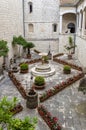 View of garden in internal patio of medieval italian monastery