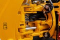 Perspective of interconnected hydraulic hoses, polished cylinders, and structural articulation hardware Royalty Free Stock Photo