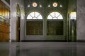 Perspective interior view of the corridor with two wooden windows at balcony of the building beautiful mosque Royalty Free Stock Photo