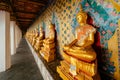 Golden Buddha statues seated in a perspective line at Wat Arun Royalty Free Stock Photo