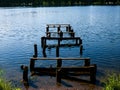 Old wooden broken pier with seagulls Royalty Free Stock Photo