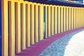 Perspective of repeated cabins for beach holidays. Long row of concrete cabins to allow vacationers to change or place objects.