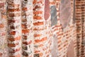 Perspective selective focus red brick wall texture background. Ancient masonry of brick and stone thousand years wall of Royalty Free Stock Photo