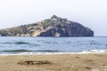 Perspective shoot of empty coastline of Mediterranean sea with blurry background of an island in Turkey Royalty Free Stock Photo