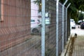 Perspective shoot of metal fences near walkline