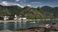 Perspective shot of a Bornhofen Kirche Kloster church placed next to the lake. Royalty Free Stock Photo