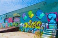 Perspective shot of colorful contemporary graffiti on the side of a loading dock in downtown Los Angeles