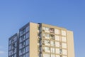 Perspective shot of tall urban reinforced constructed modern building with blue sky in Izmir at Turkey at summertime