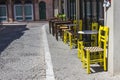 Perspective shot of urban summer cafe with stone road at Lesvos, in Mytilene