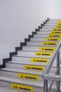 Perspective side view of calories burned stickers on staircase inside of office building Royalty Free Stock Photo