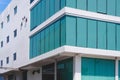 Perspective side view of green roller blinds inside of white industrial office building in modern style Royalty Free Stock Photo