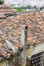 Perspective vertical shot of old masonry constructed housing roof structure with over cast sky in Izmir at Turkey