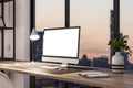 Perspective view on blank white modern computer monitor with place for your logo or text on stylish wooden table on panoramic