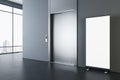 Perspective view on blank white poster on dark glossy floor in spacious modern office hall with grey wall, metallic elevator doors Royalty Free Stock Photo