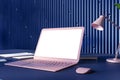 Perspective view on blank white screen with place for your logo on modern pink laptop on dark table with notebooks and stylish Royalty Free Stock Photo