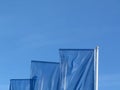 Perspective view of blue flags under blue sky Royalty Free Stock Photo