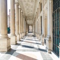 Perspective view of classic roman colonnade. Architectural details of the building. Royalty Free Stock Photo