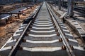 Perspective view of Concrete railroad ties in railway construction site Royalty Free Stock Photo