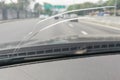 Perspective view of cracked car windscreen or windshield while d