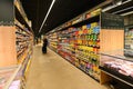 Perspective view of almost deserted supermarket shelves rows