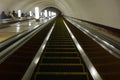 Perspective view down from the moving escalator of Smolenskaya underground station before its renovation. Royalty Free Stock Photo