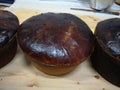 Perspective view of a easter cakes of brown color resting on a light woode closeup