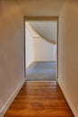 perspective view of empty corridor and open door frame to empty room Royalty Free Stock Photo