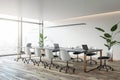 Perspective view of empty conference room with office table and chairs, panoramic window, wooden floor and white walls. 3D Royalty Free Stock Photo