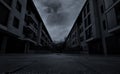 Perspective view of empty road between residential building with dark clouds and sky in the city. No people on urban street. Real Royalty Free Stock Photo