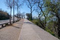 Perspective view on empty walking path along the Mediterranean sea