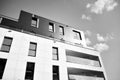 Fragment of a facade of a building with windows and balconies. Black and white. Royalty Free Stock Photo