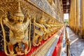 Perspective view of golden religious statue Statue Garuda in wat phra kaew temple, Bangkok, Thailand