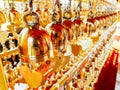 Perspective view group of small golden bells hang in Thai temple Royalty Free Stock Photo