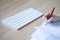 Little girl writing with fountain pen in her notebook Royalty Free Stock Photo